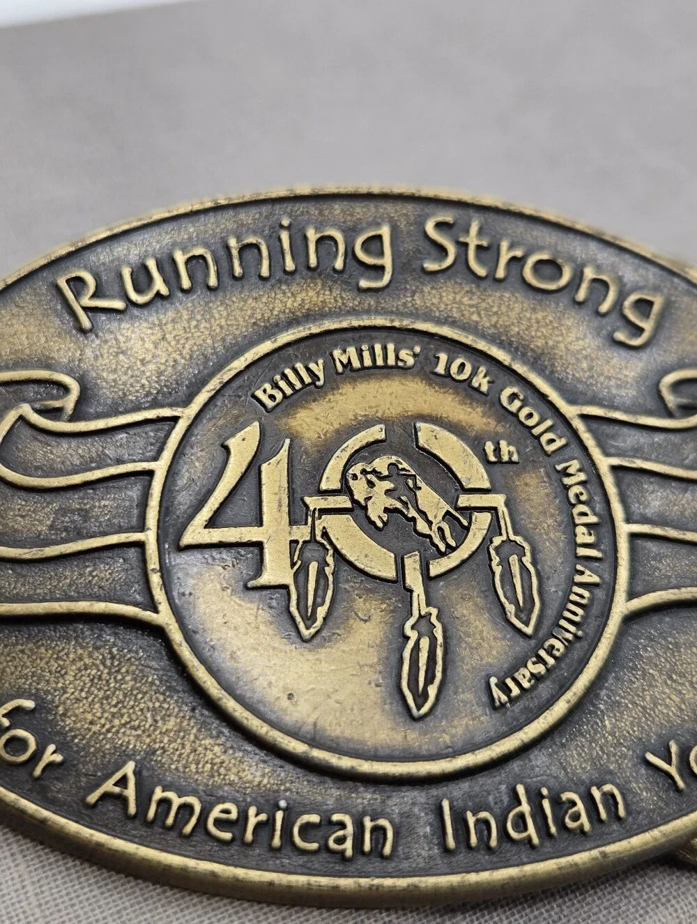 Running Strong Billy Mills Anniversary BELT BUCKLE VTG American Indian Youth
